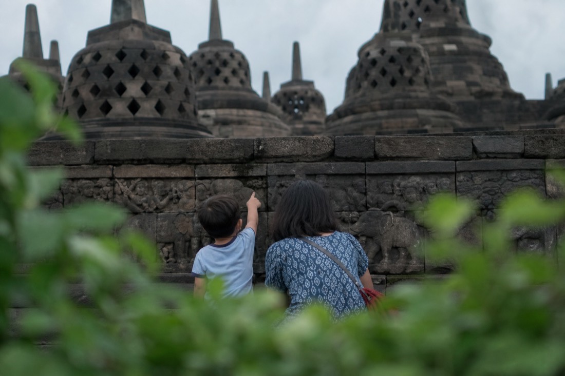 A child discovering the carvings of Borobudur