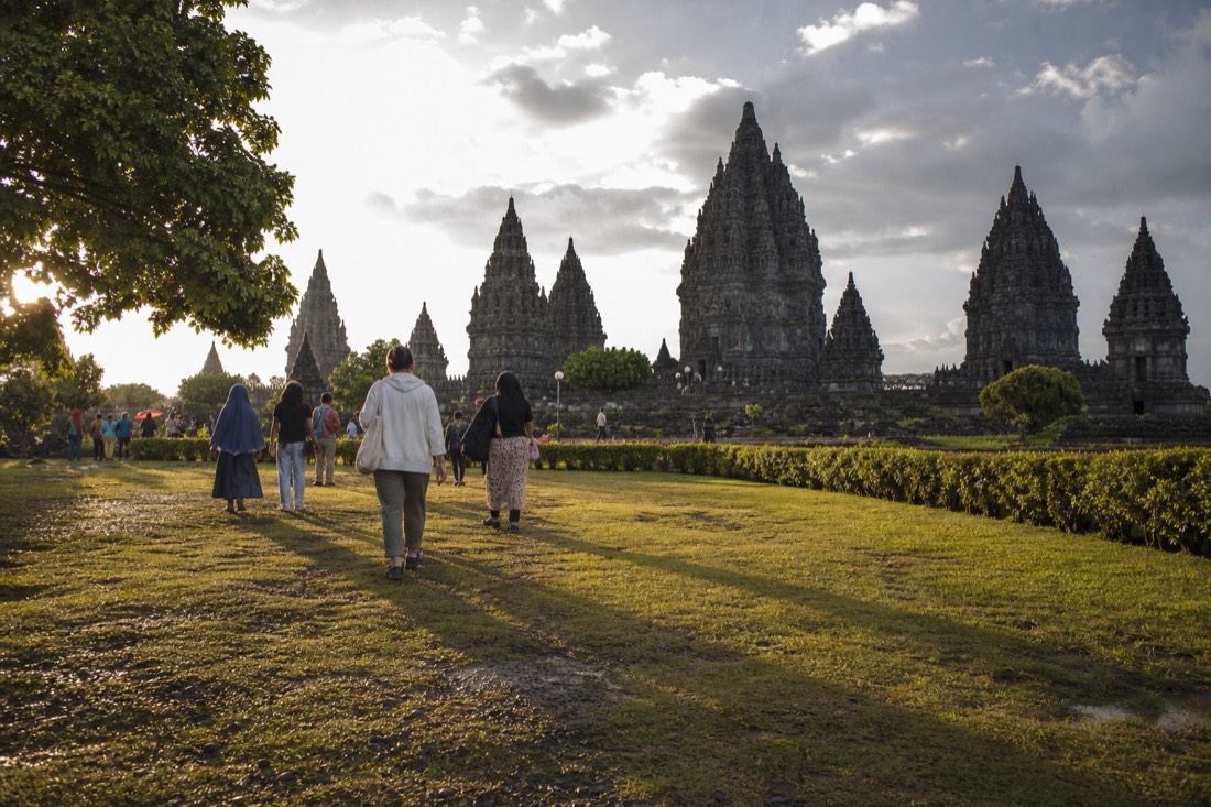 Golden hour across the lawns of Prambanan